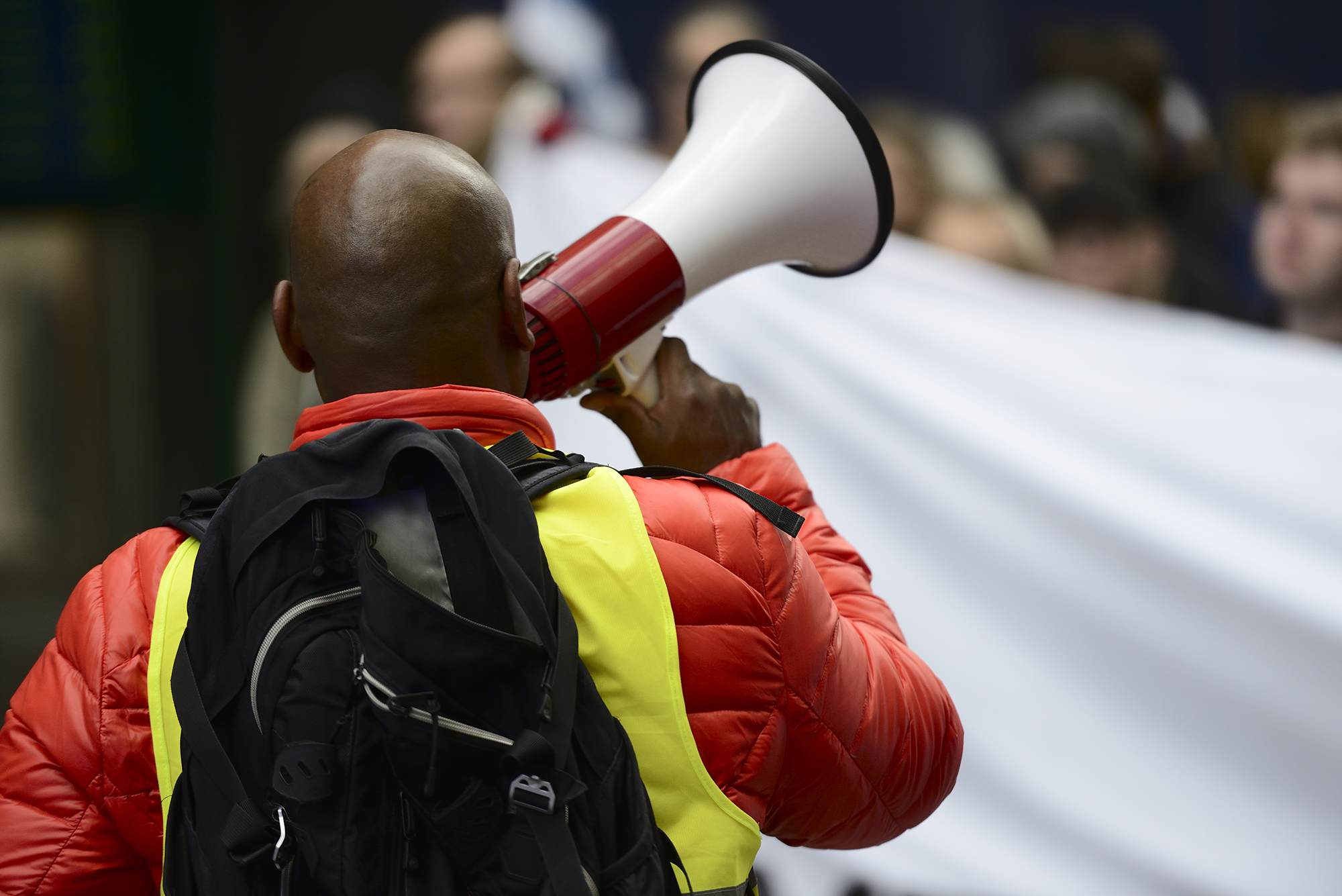 Man with megaphone at industrial action